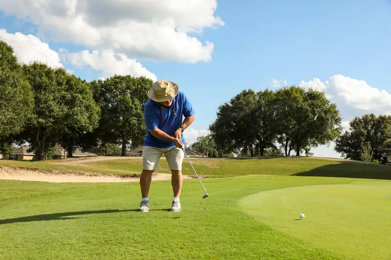 A resident putting on the green
