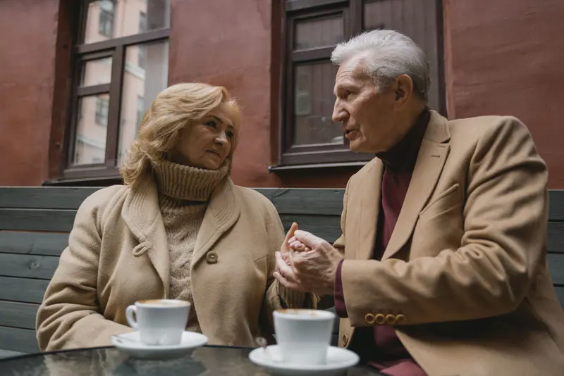 A couple sharing coffee on the patio