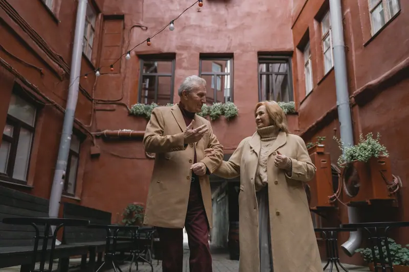 A couple strolling arm in arm