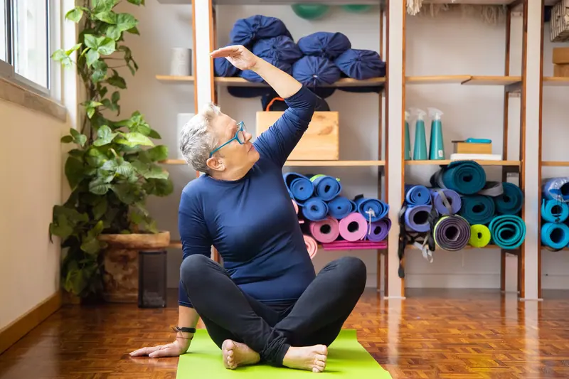 A resident stretching in the yoga studio