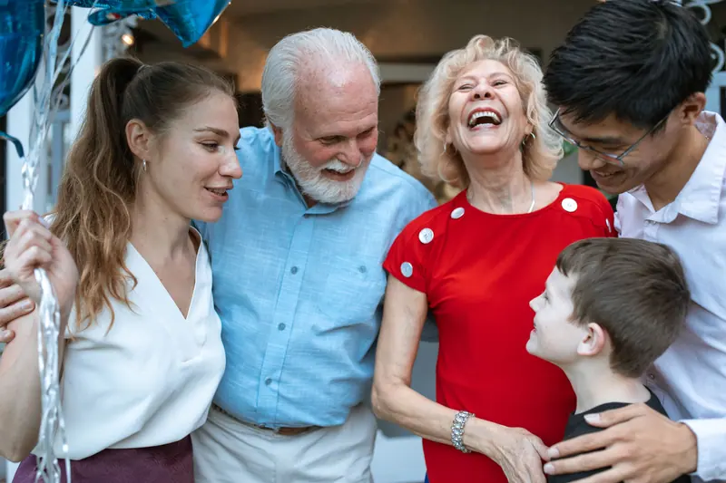A family laughing together on a visit
