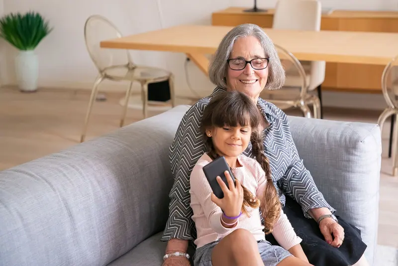 A grandmother and grandchild taking a selfie