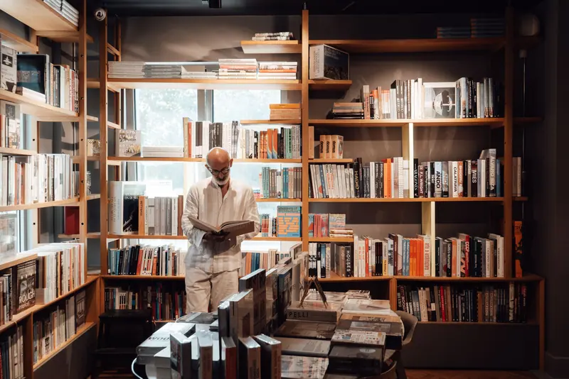 A resident browsing the library shelves