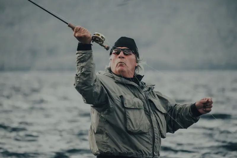 A resident casting a line at the lake