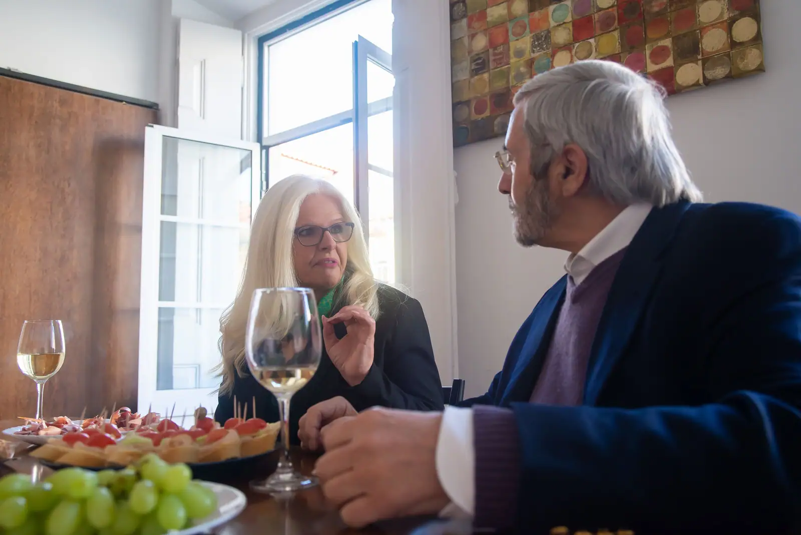A couple sharing wine and appetizers