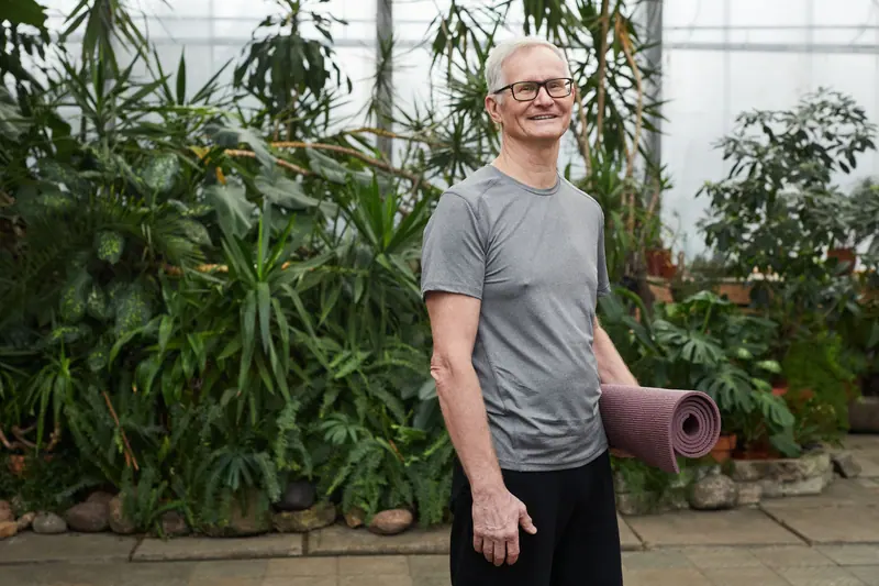 A resident arriving for yoga in the greenhouse