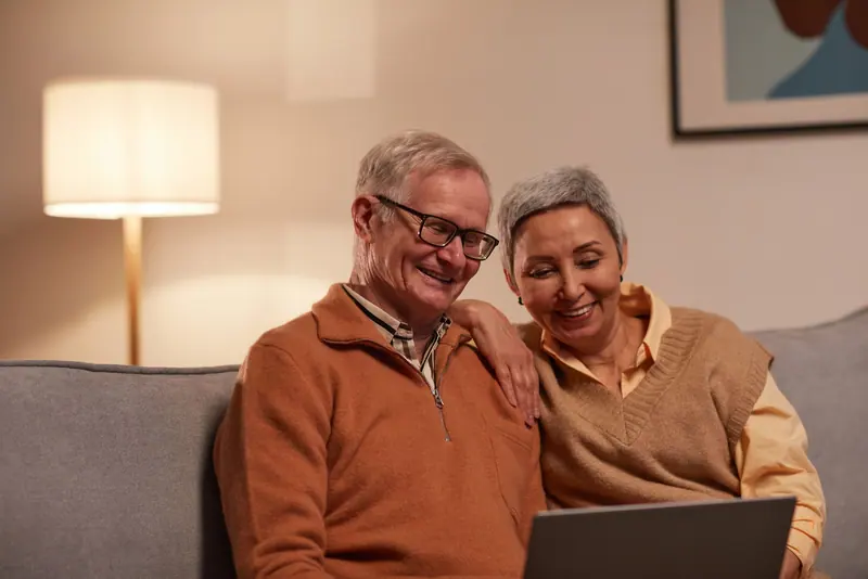 A couple on the laptop at home