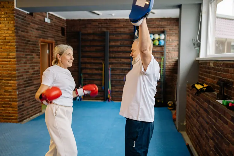 A couple boxing in the fitness studio