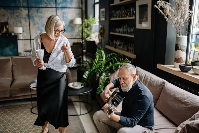 A couple enjoying music at home