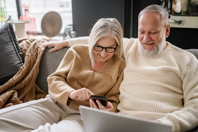 A couple scrolling photos together
