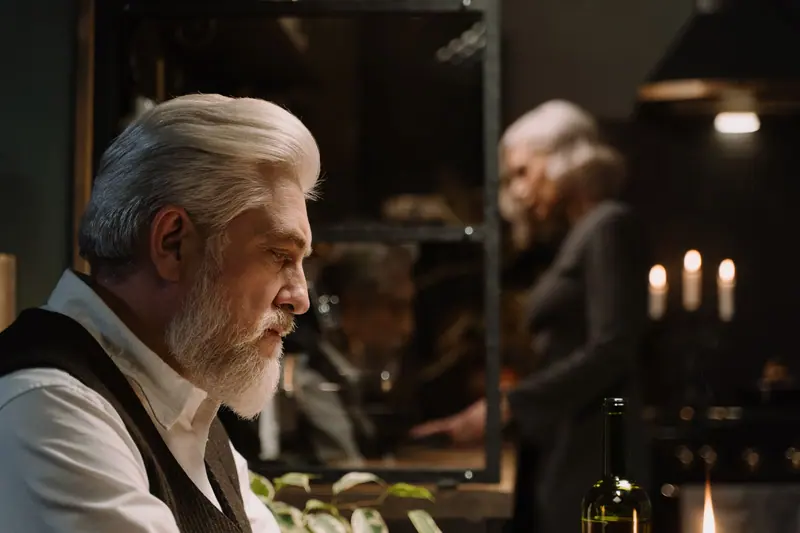 A couple at a candlelit dinner in their apartment