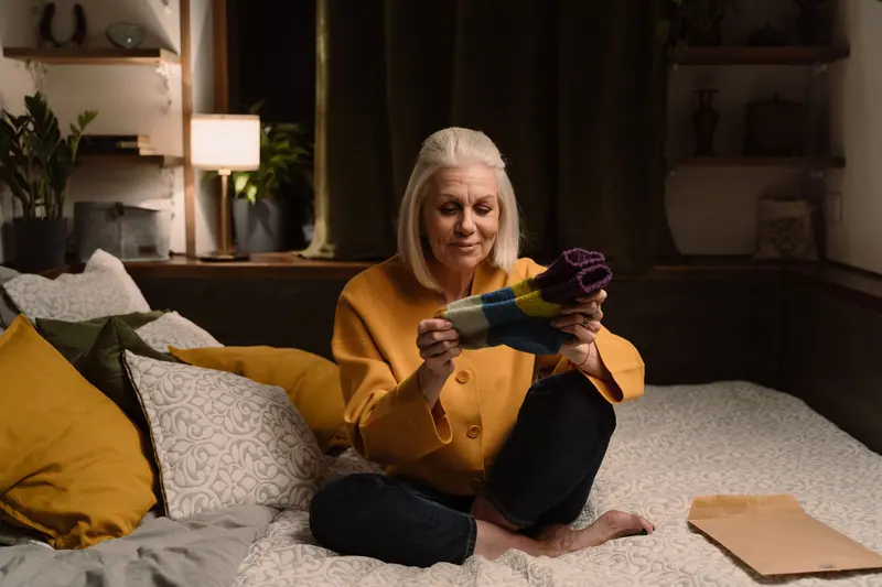 A resident relaxing in a cozy sweater