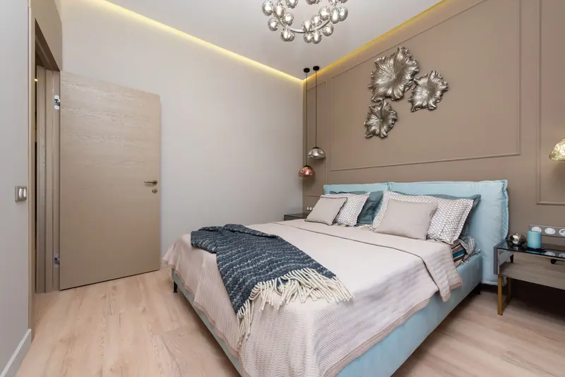 Bright and spacious contemporary bedroom with elegant decor and minimalist design.