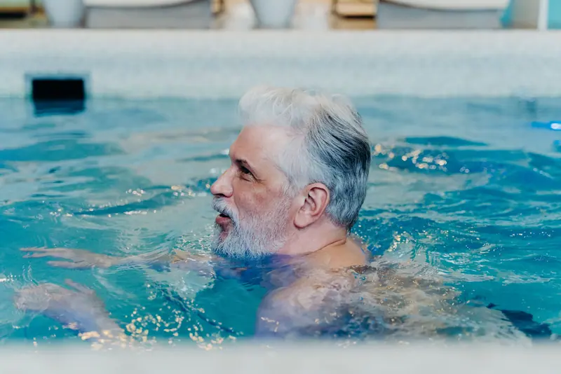 A resident swimming laps in the pool