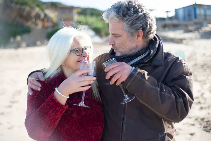 A couple sharing a glass of wine on vacation