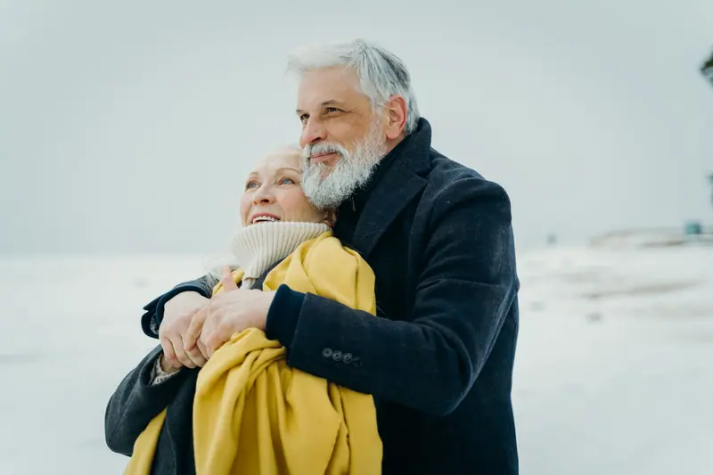 A couple embracing in the snow