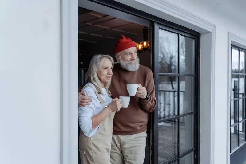 A couple with their morning coffee at home