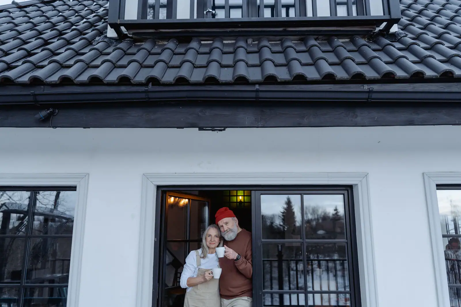 A couple at the door with their morning coffee