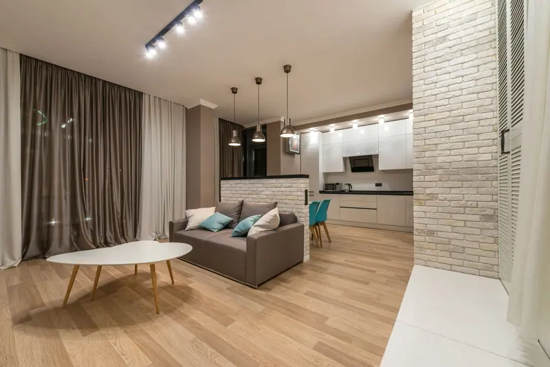 A stylish and spacious open plan living room with a modern kitchen design.