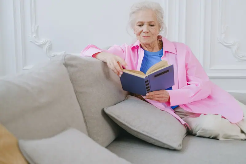 A resident with a novel on the sofa