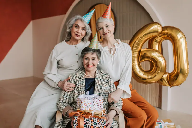 Friends celebrating a birthday with balloons