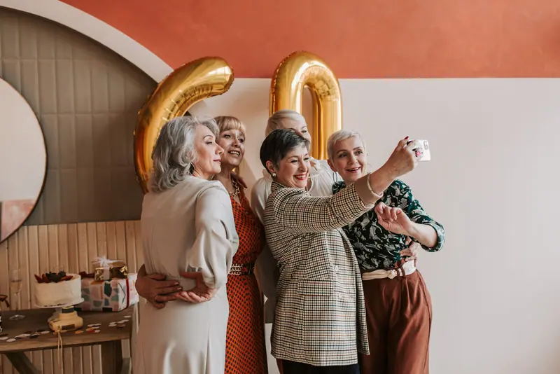 Friends taking a selfie at a birthday party