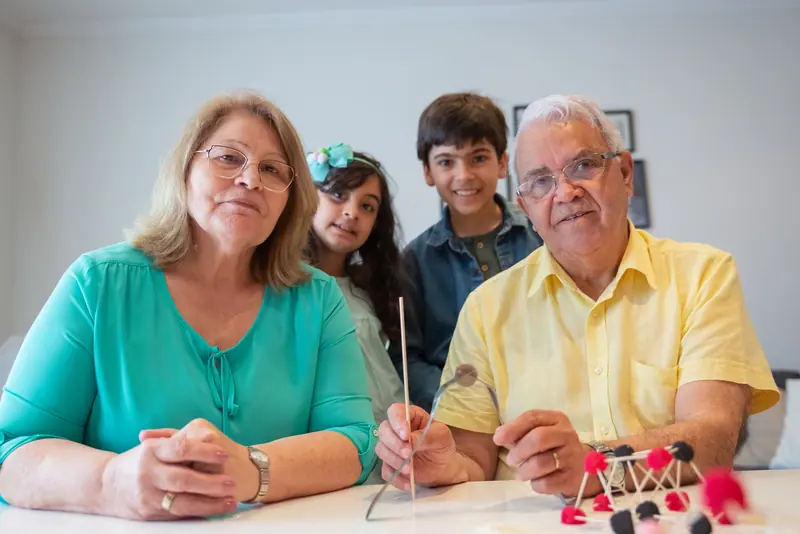 Grandparents with their grandchildren at the dining table