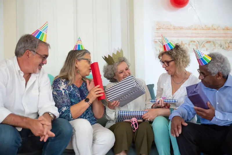 Friends exchanging gifts at a party