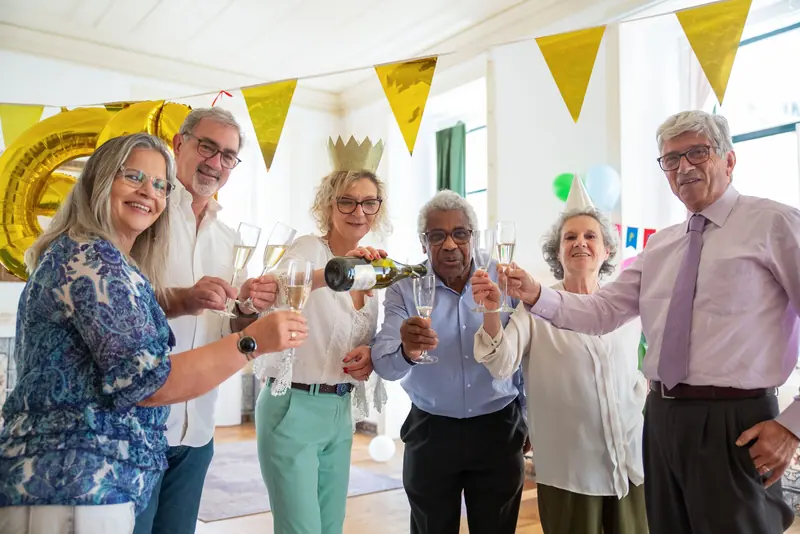 Friends raising a toast at a birthday party