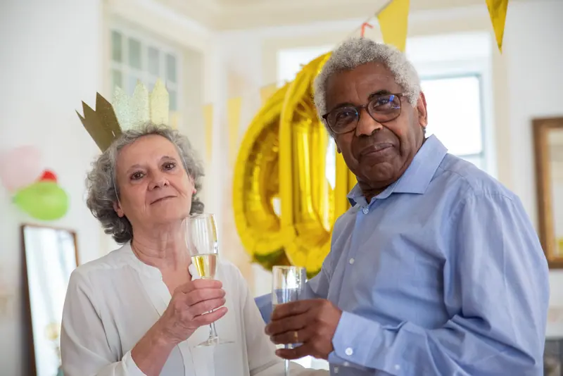 A couple toasting at a holiday party
