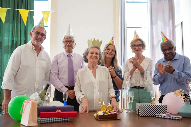 Residents celebrating a birthday with cake