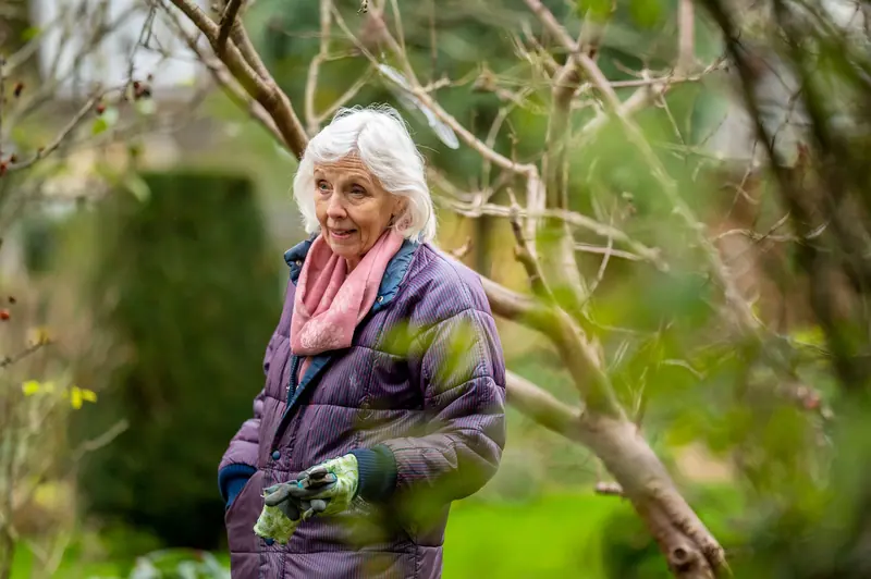 A resident walking the garden in spring