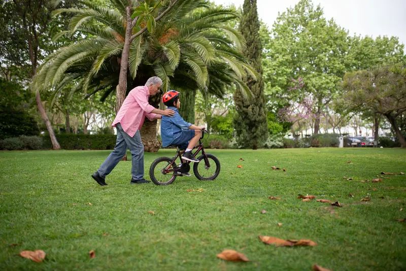 Teaching a grandson to ride a bike