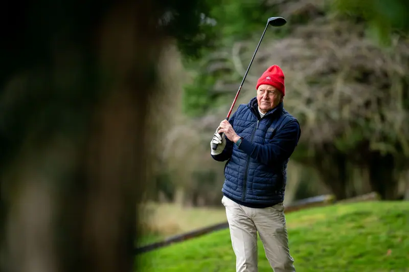 A resident teeing off on a cold morning at the golf course down the road