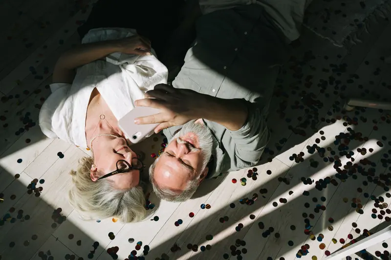 A couple on the floor among the confetti