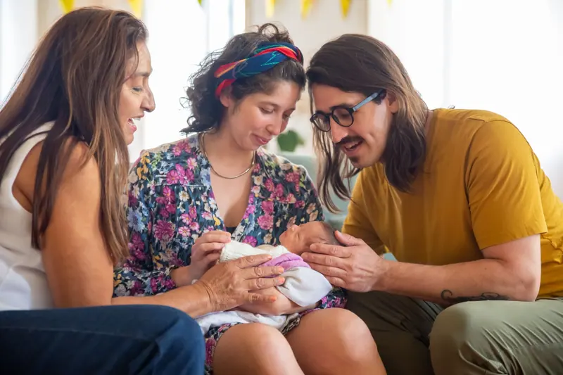 A family introducing the newest great-grandchild