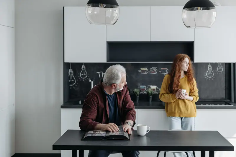 A grandfather and granddaughter in the kitchen
