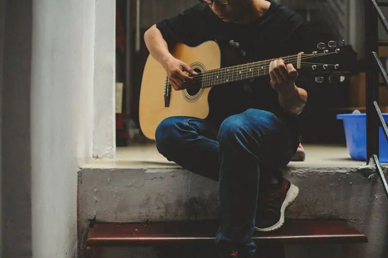 A guitarist on the steps