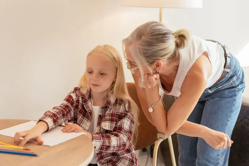 A grandmother helping with homework