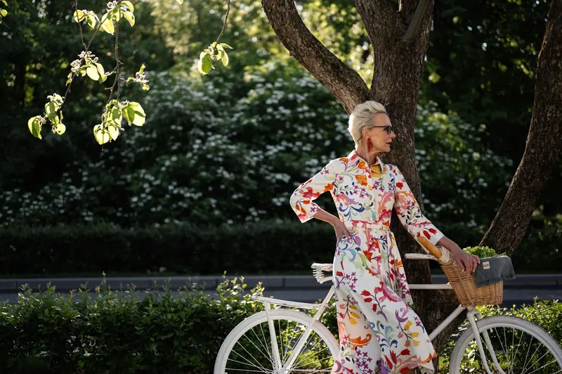 A resident with her bicycle on the garden path