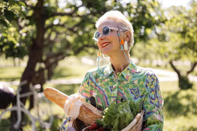 A resident with bread and greens from the market
