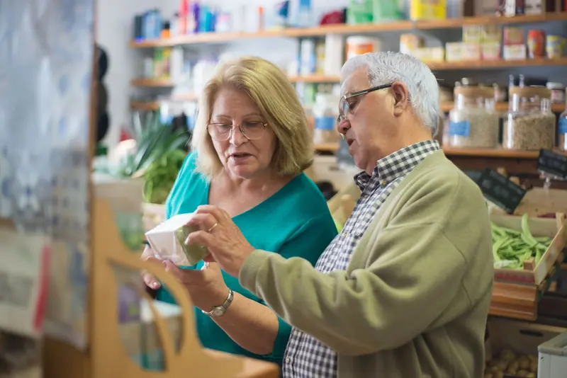 A couple browsing the market aisles