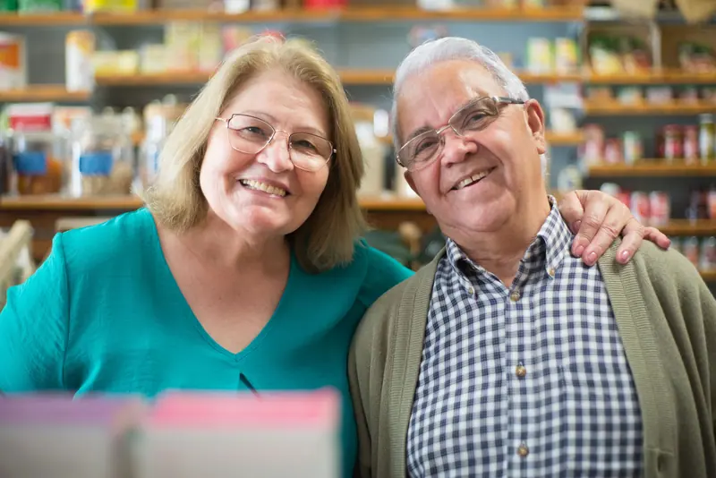A couple stopping for a photo in the gift shop