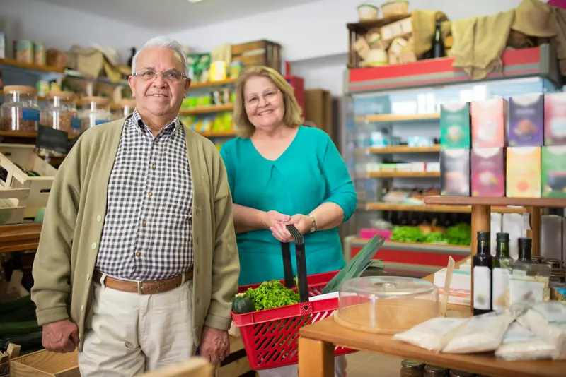 A couple laughing at the checkout