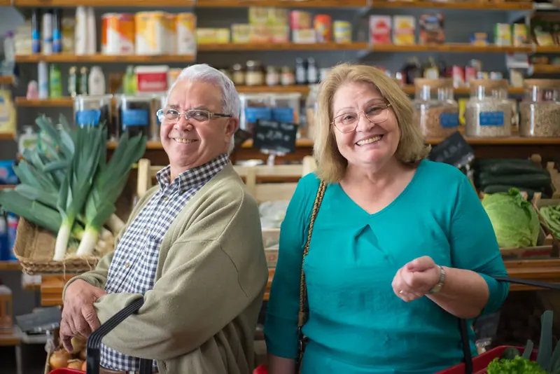A couple choosing vegetables at the Saturday market