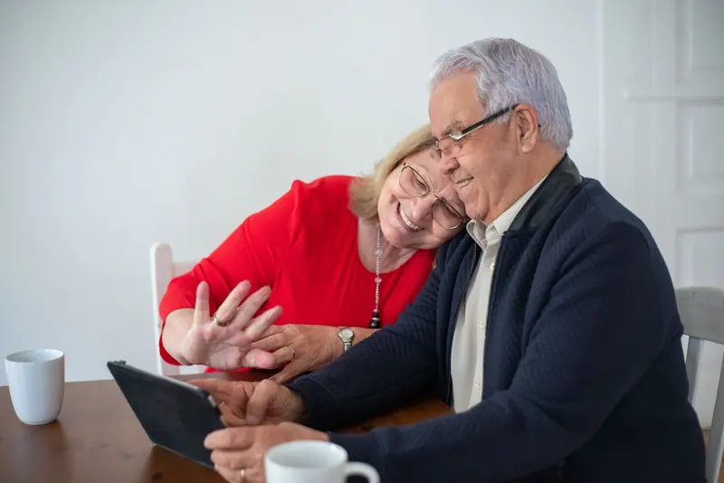 A couple reading the news on a tablet