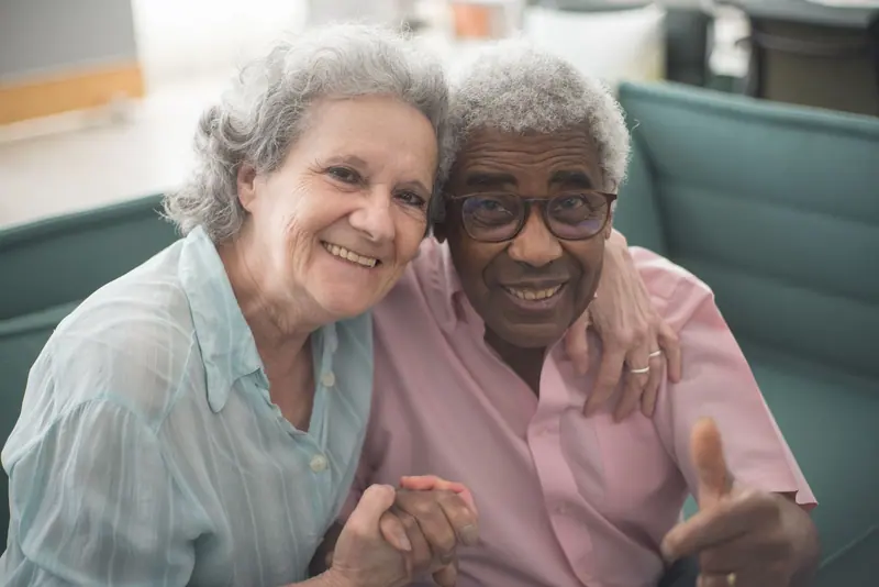 A couple smiling together in the dining room