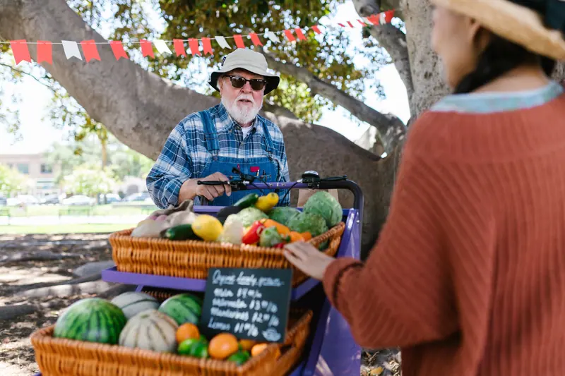 A resident selling vegetables at the Saturday market