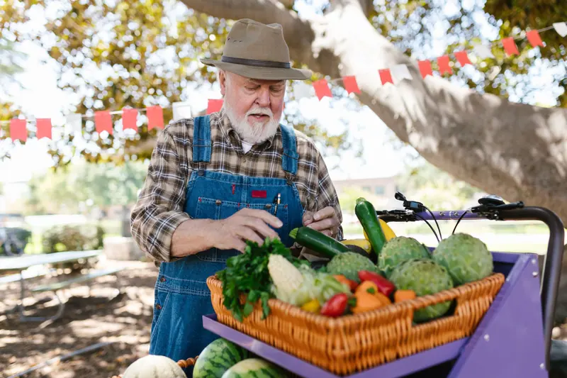 A resident arranging the market stand