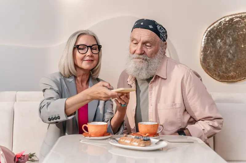 A couple sharing pastries at the café